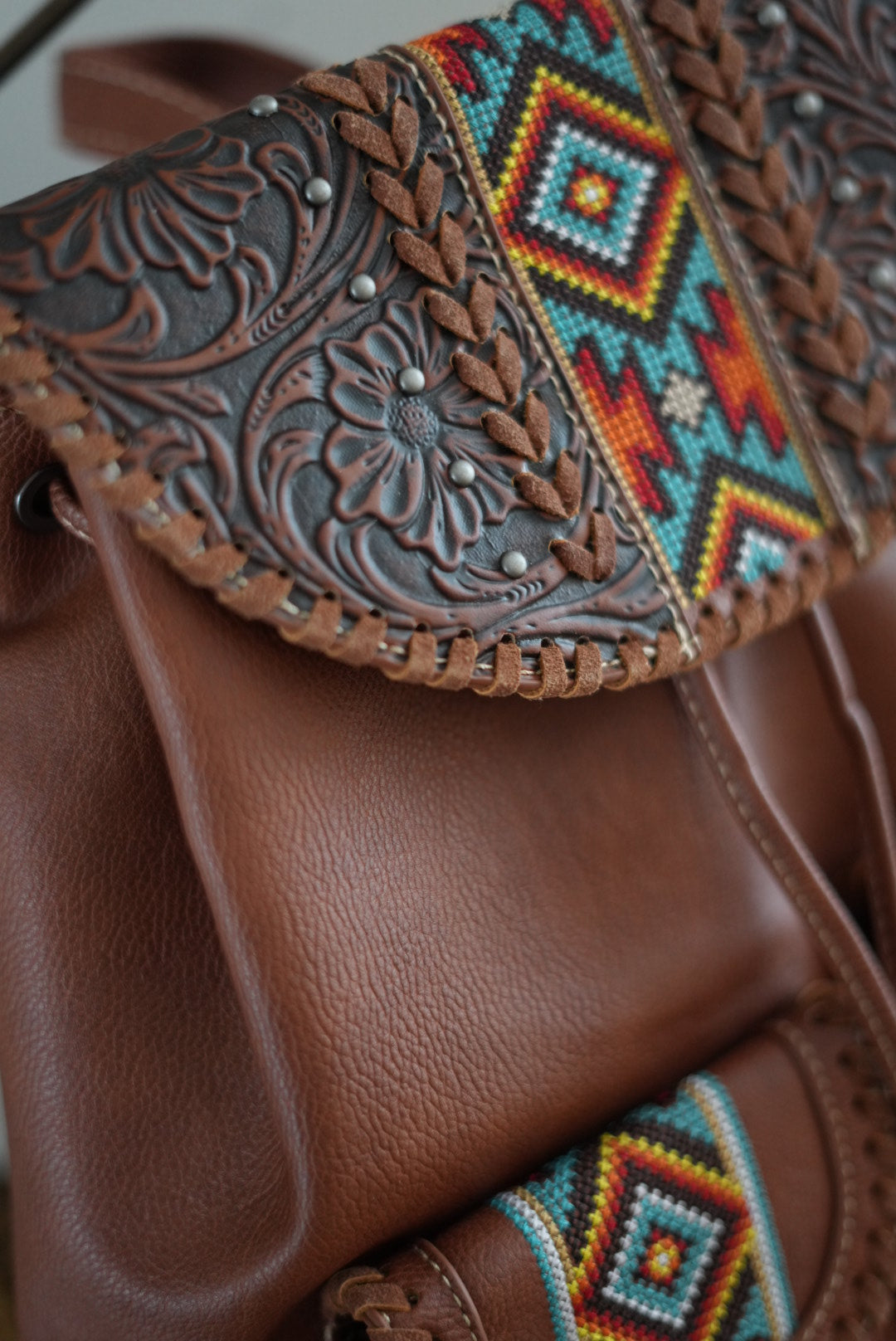 Tooled faux leather Aztec backpack