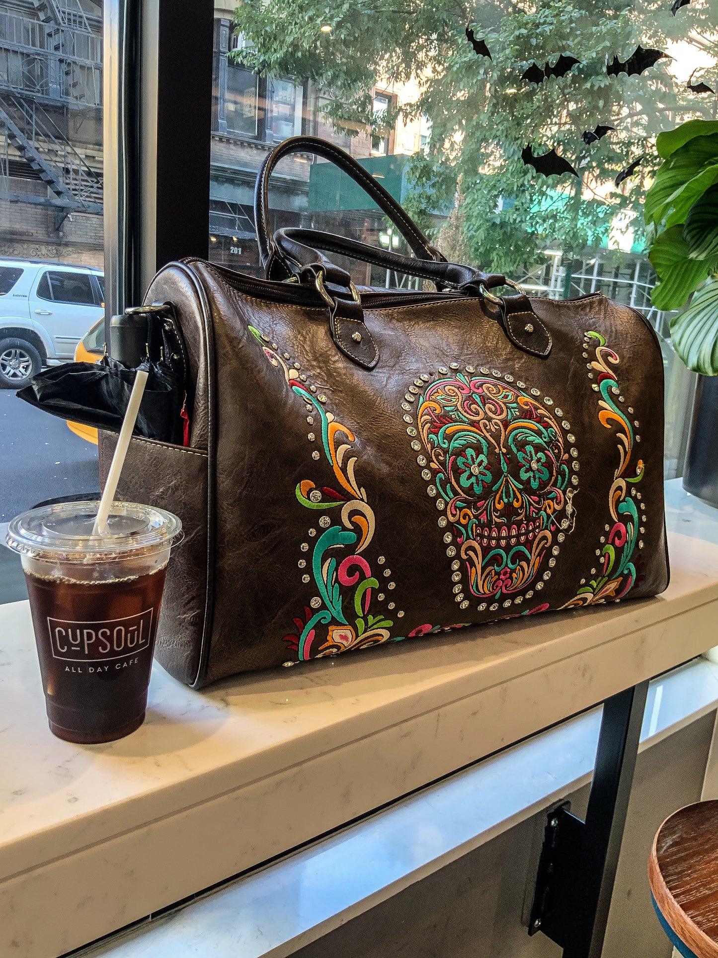 Brown skulll weekender bag