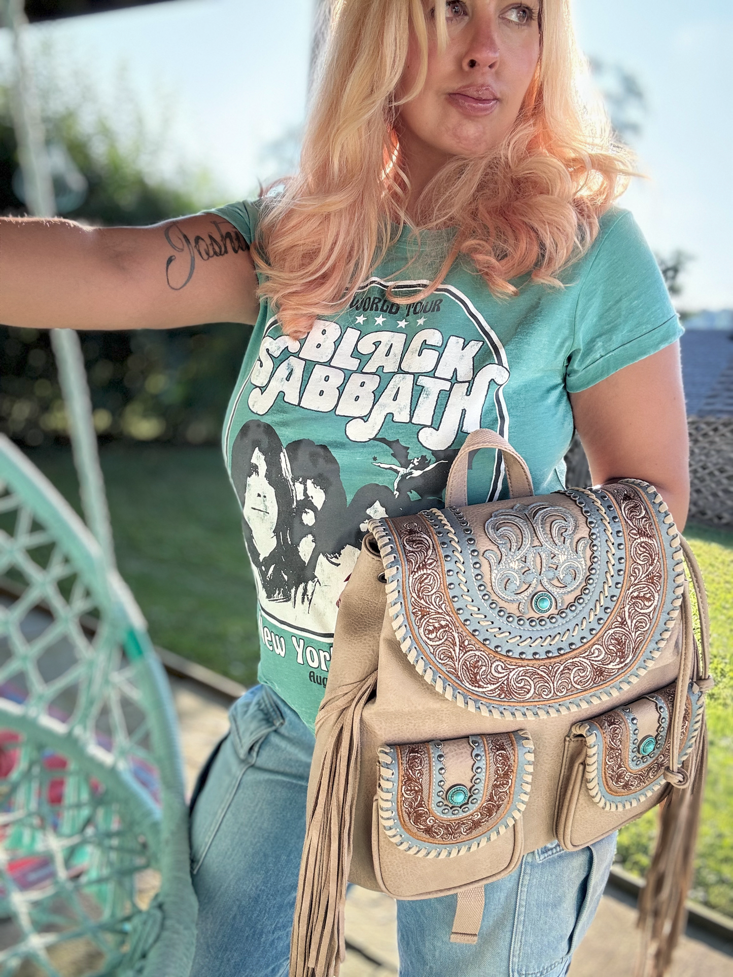 Black Sabbath T-shirt, turquoise backpack light tan vegan leather 