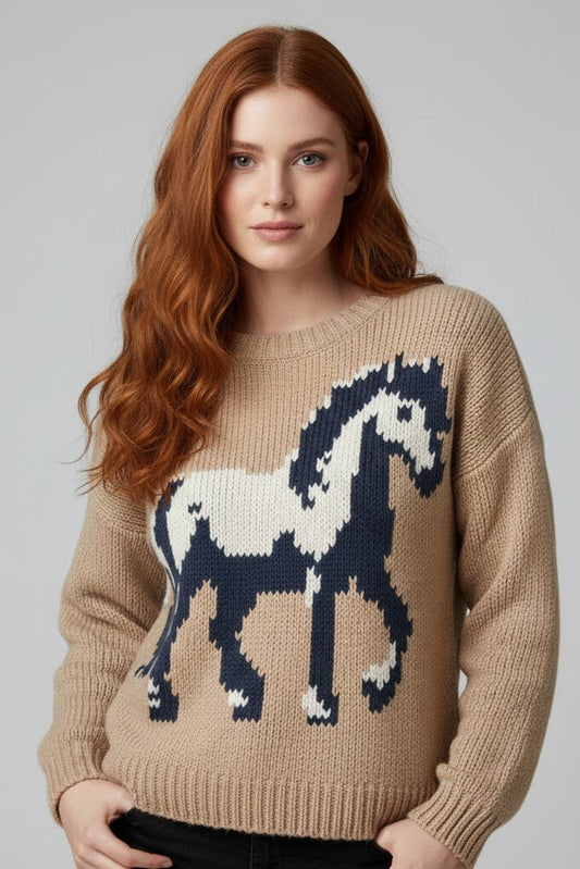 Woman wearing a beige sweater with a horse design on a gray background