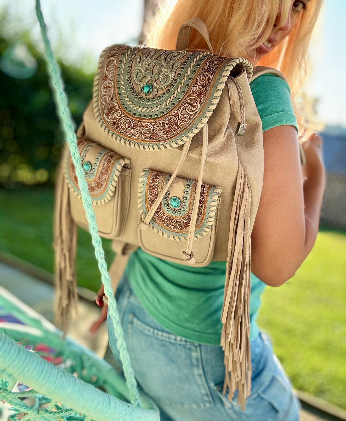 a backpack or a worn-in leather bag perhaps with fringe Celebrity Daytrip Studded Vegan Leather Embroidered Fringe Backpack in – AlyandJoshua